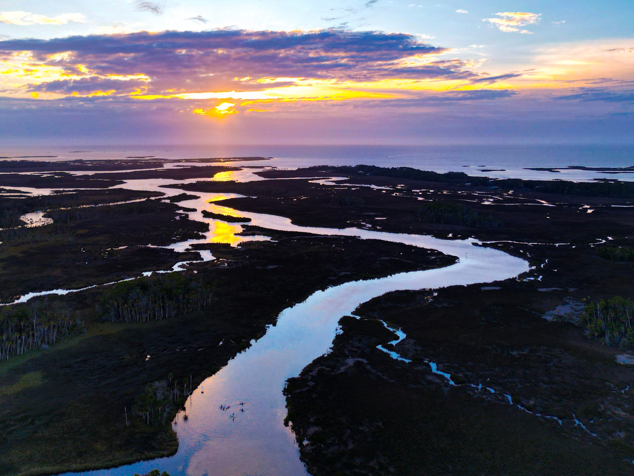 a sunset over a body of water