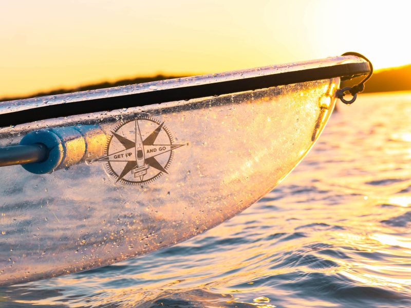a person riding a surf board on a body of water