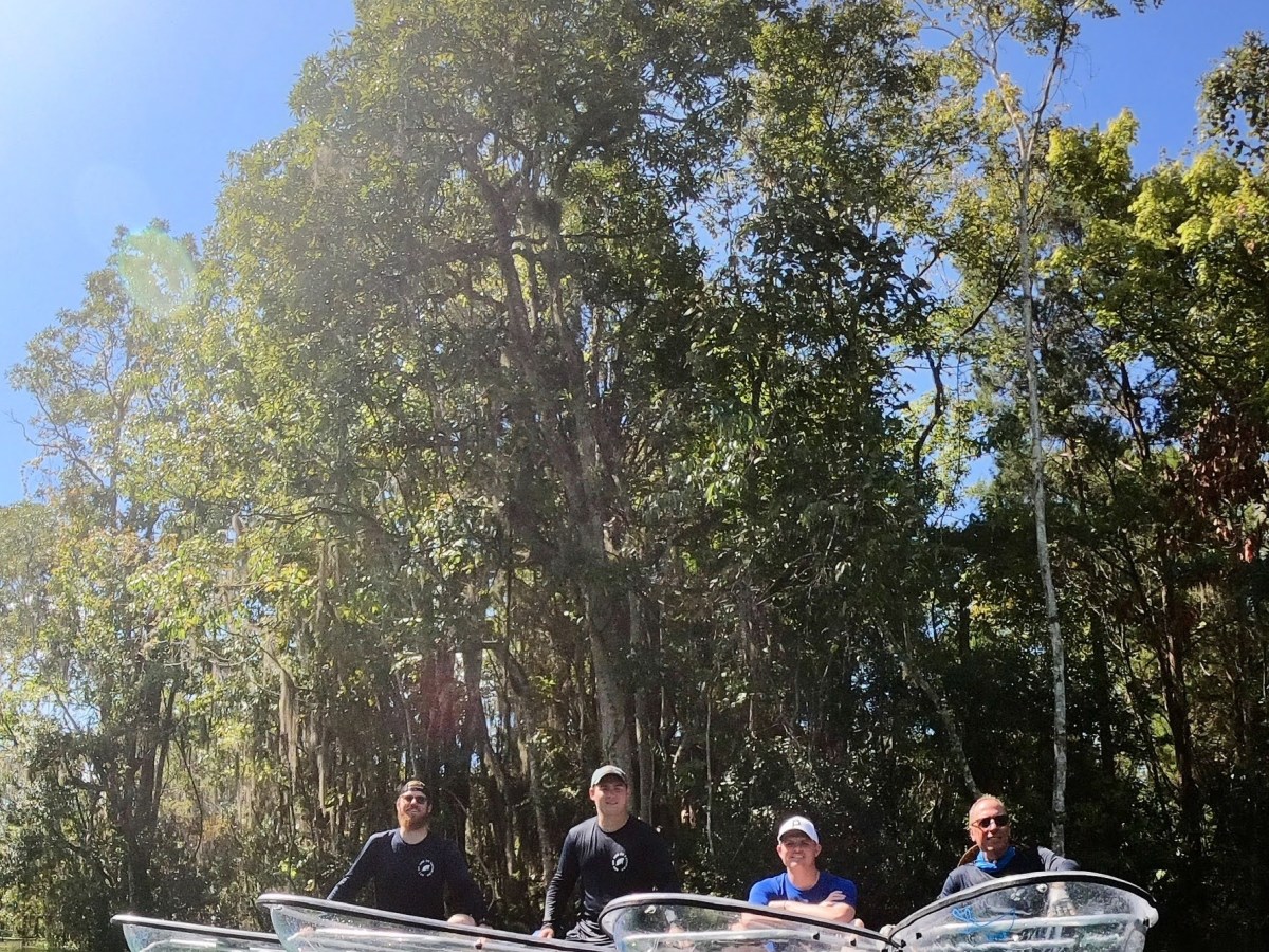 a group of people on a boat in the water