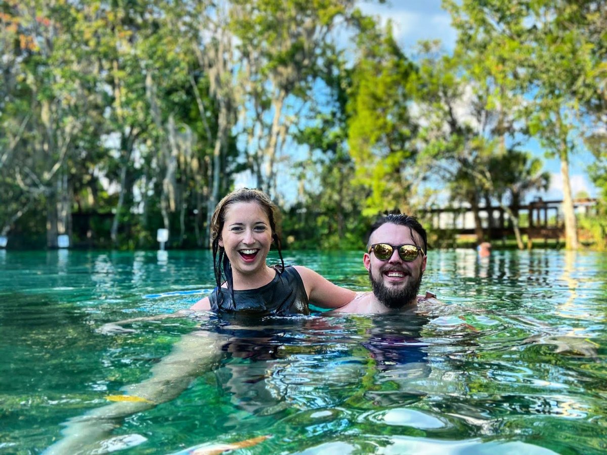 a man swimming in a body of water