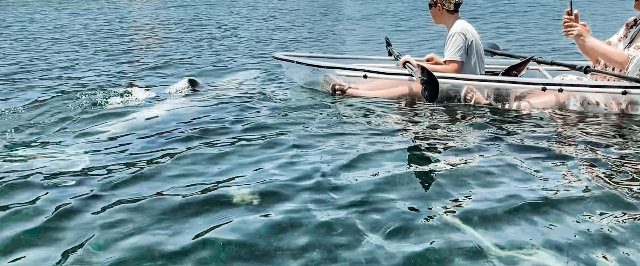 a group of people on a boat in the water