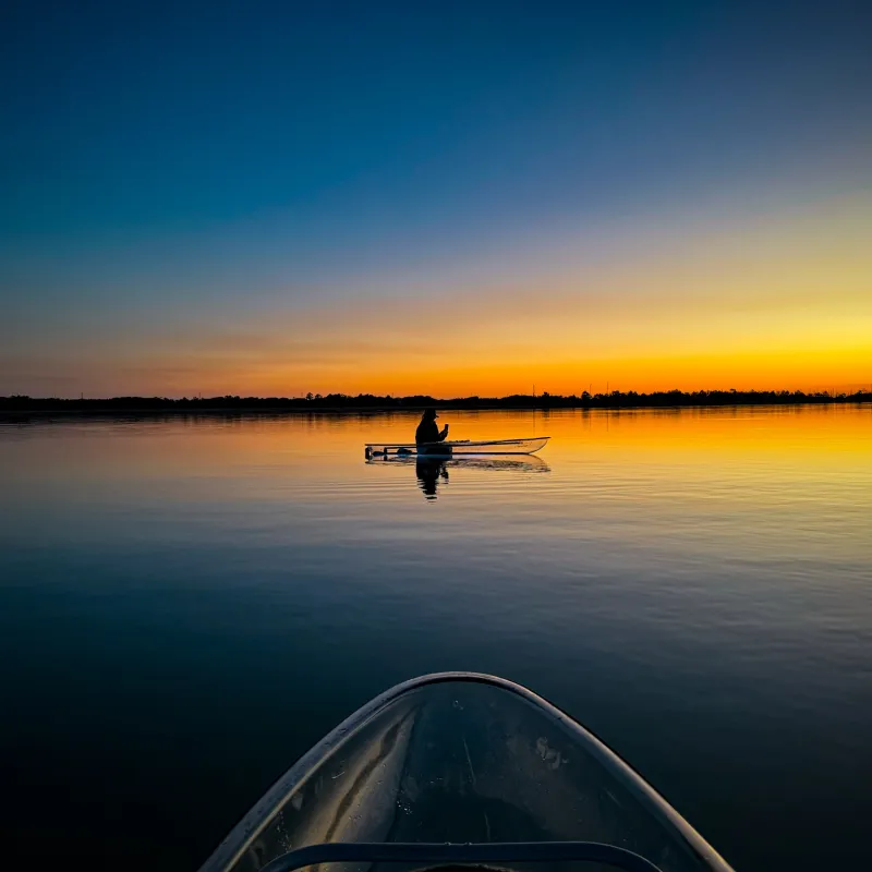 a sunset over a body of water