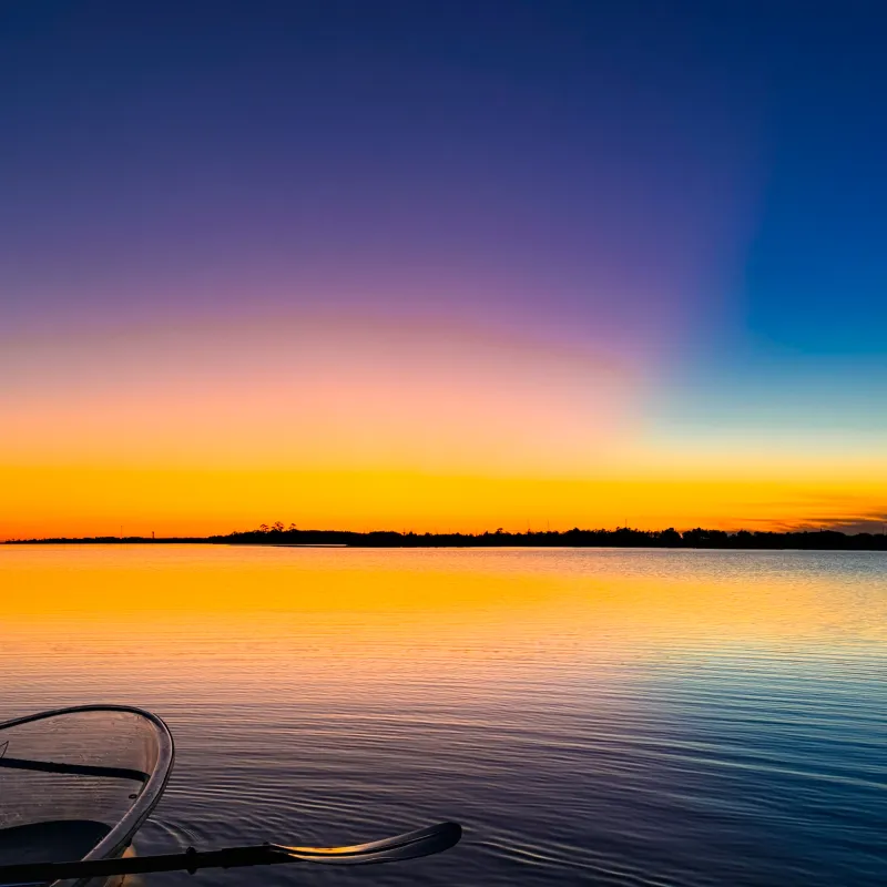 a sunset over a body of water