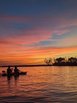 a small boat in a body of water