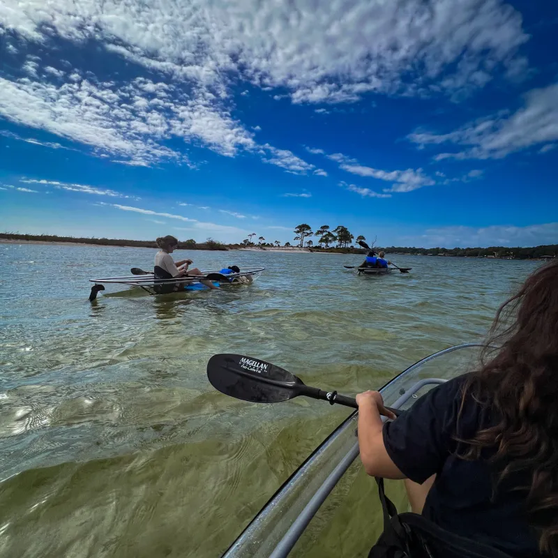 a person standing next to a body of water