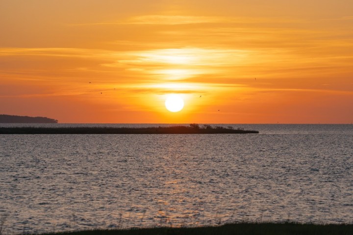 a sunset over a body of water