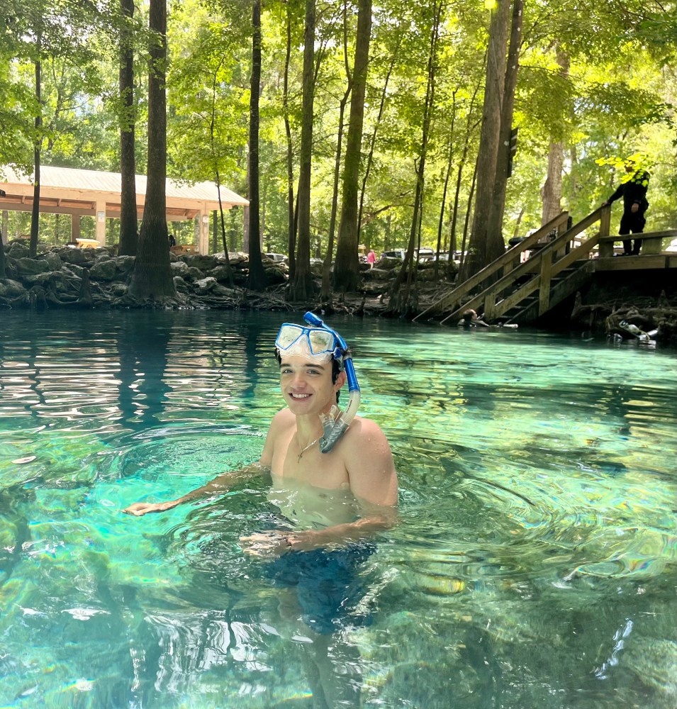 a person swimming in a pool of water