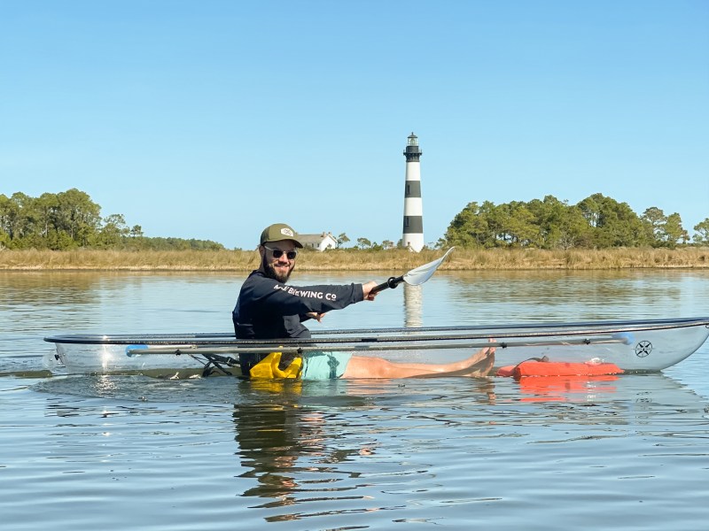 a man rowing a boat in the water