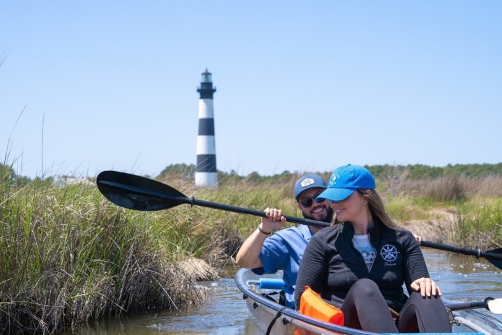 a person rowing a boat in a body of water