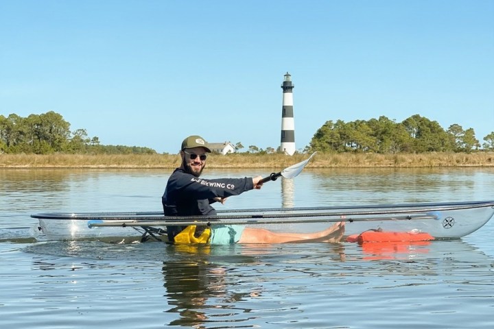 a man rowing a boat in the water
