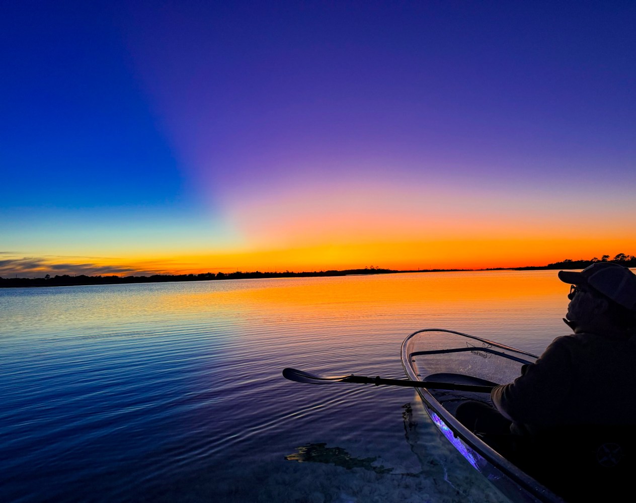 a sunset over a body of water