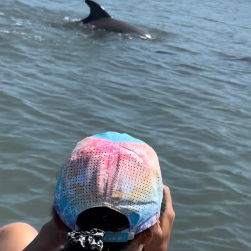 a woman swimming in a body of water