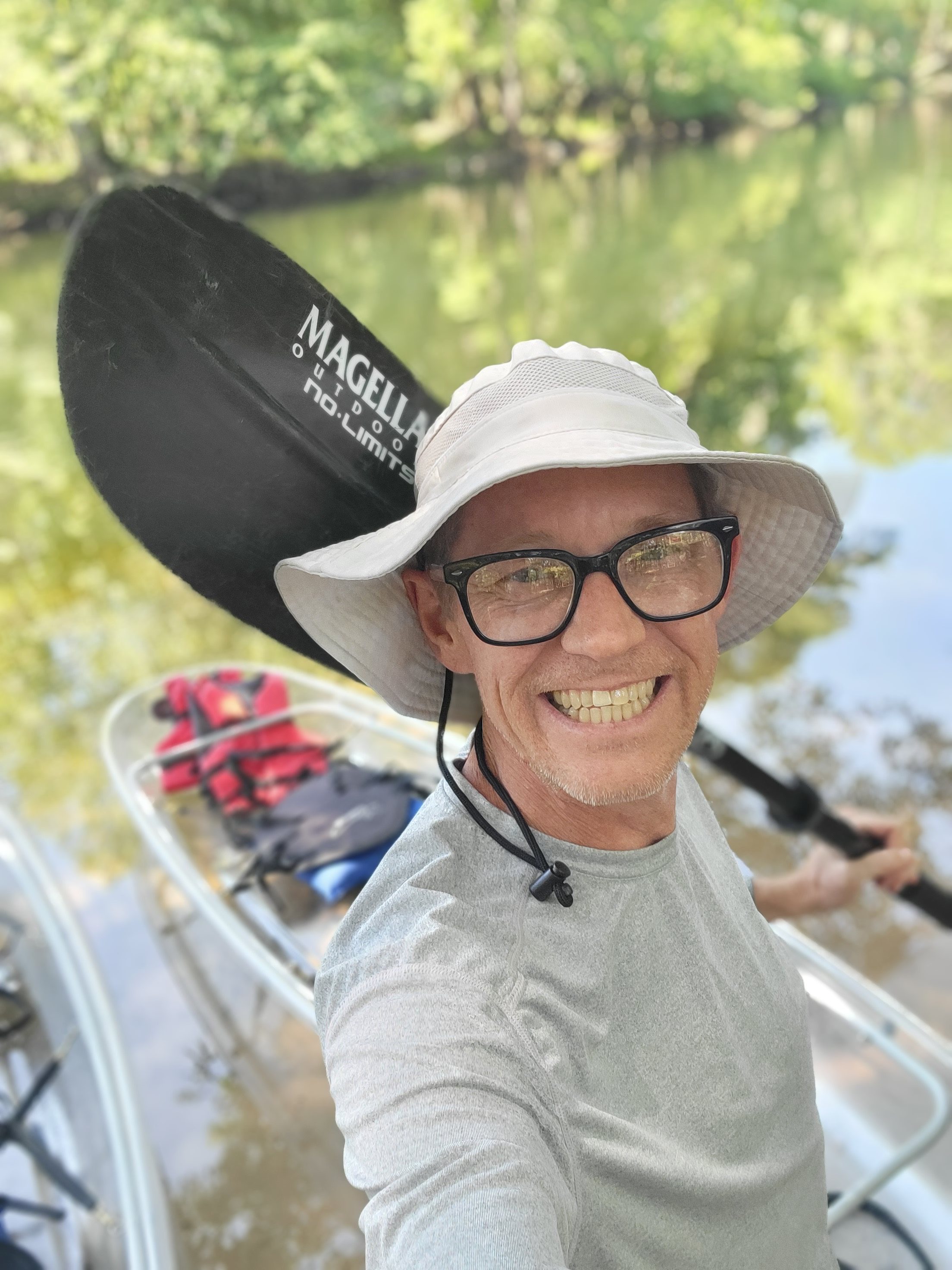 a person riding on the back of a boat in the water