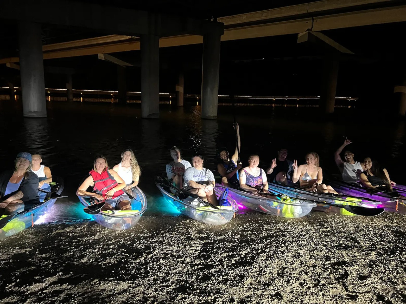 a group of people riding on the back of a boat