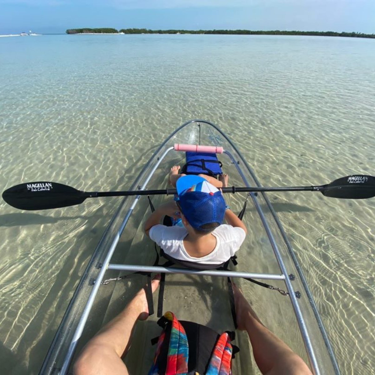 a person sitting in a boat on a body of water