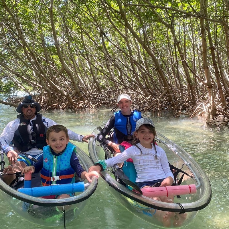 a group of people riding on the back of a boat