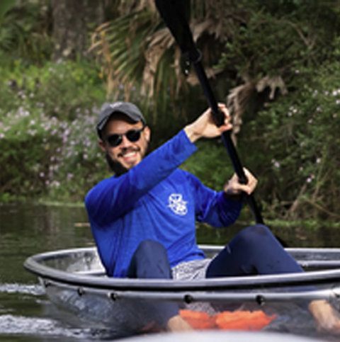 a man riding on the back of a boat