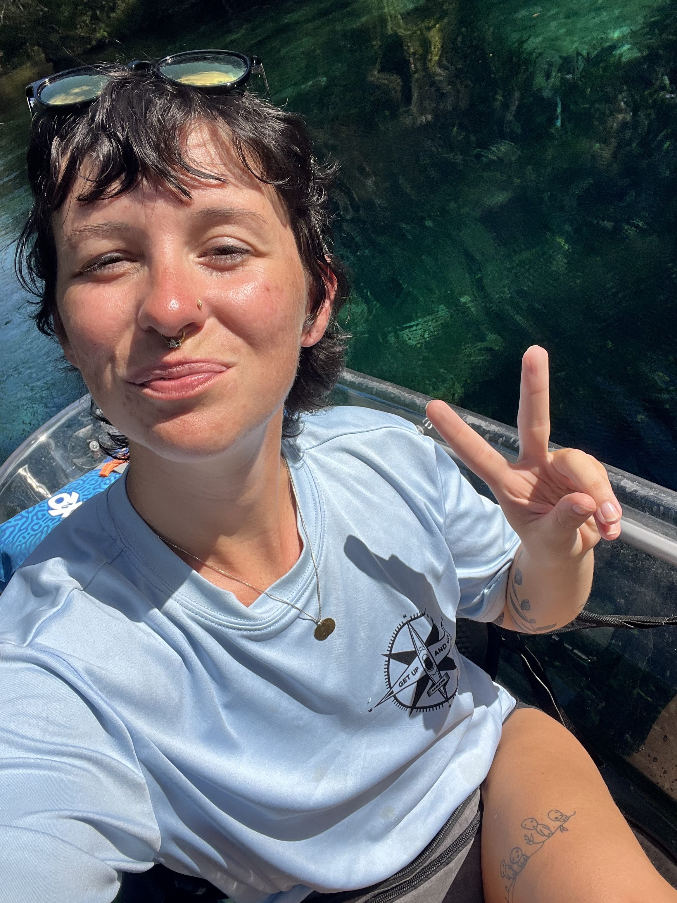 a person riding on the back of a boat in the water