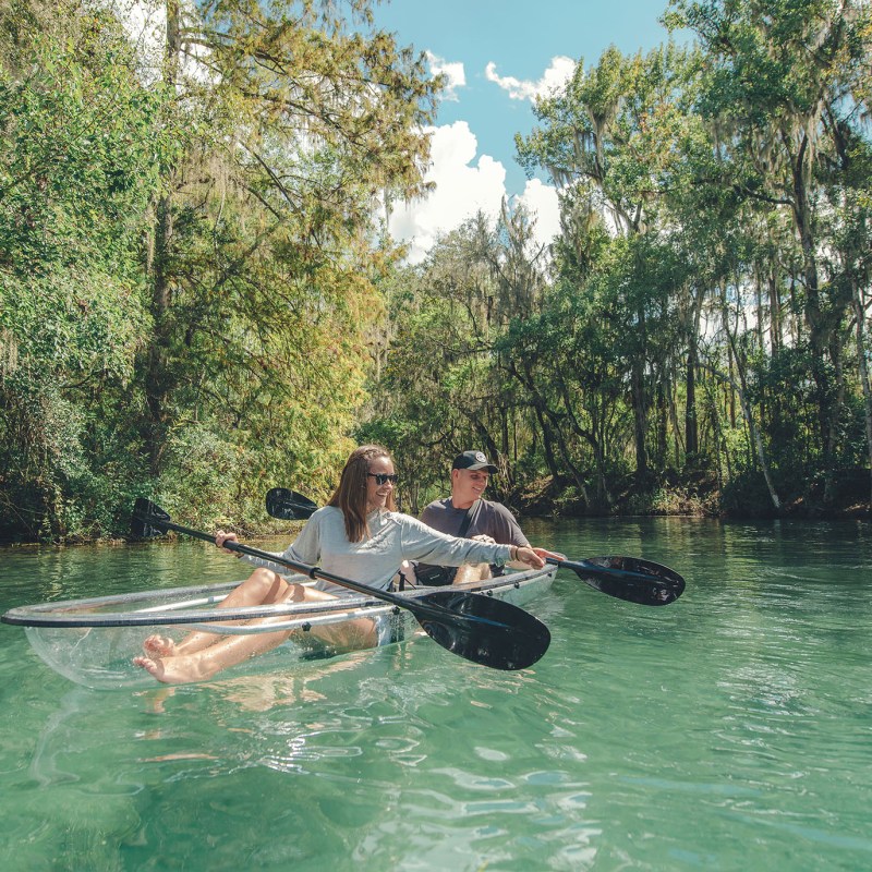 a young man riding a surfboard in the water