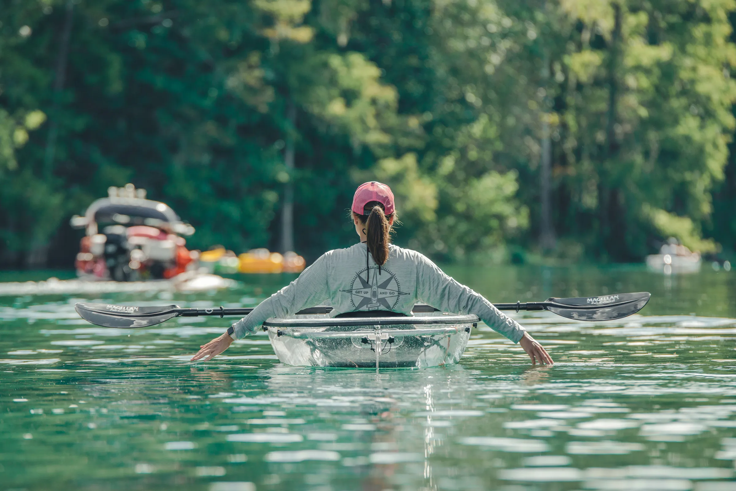a man flying through the air while swimming in a body of water