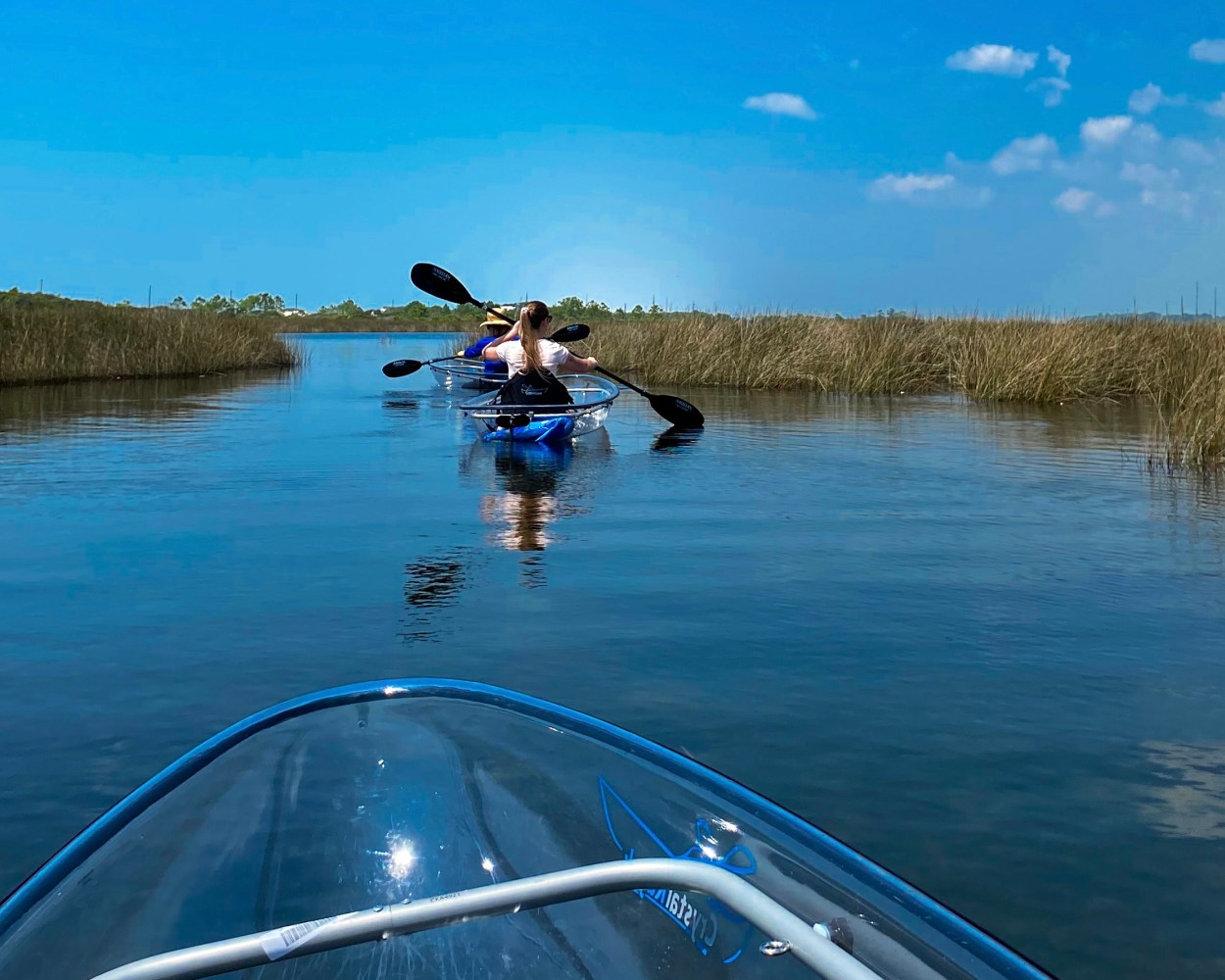 a person riding on the back of a boat in a body of water