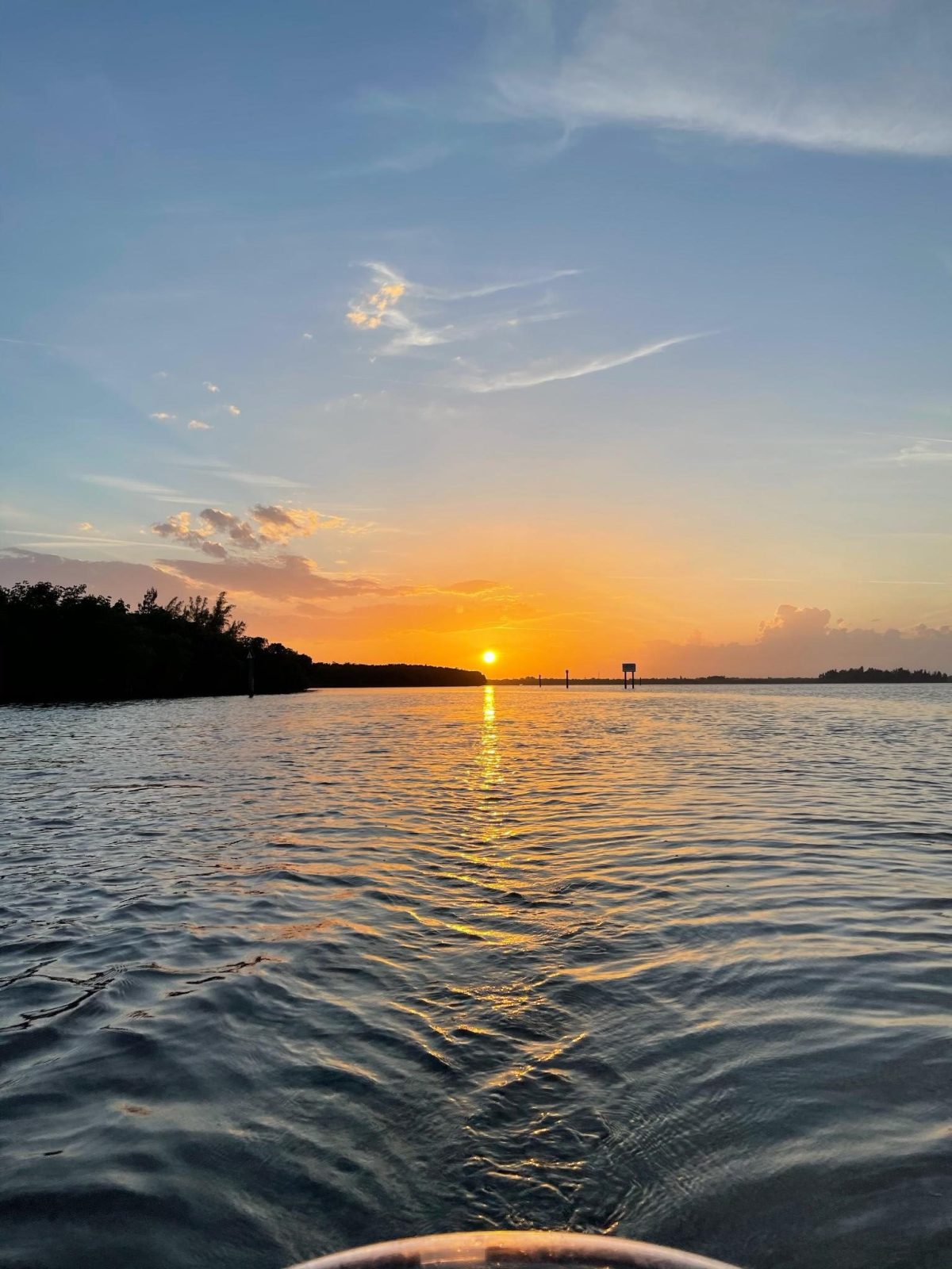 a sunset over a waterfall