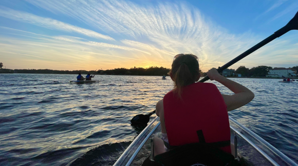 a man in a boat on a body of water