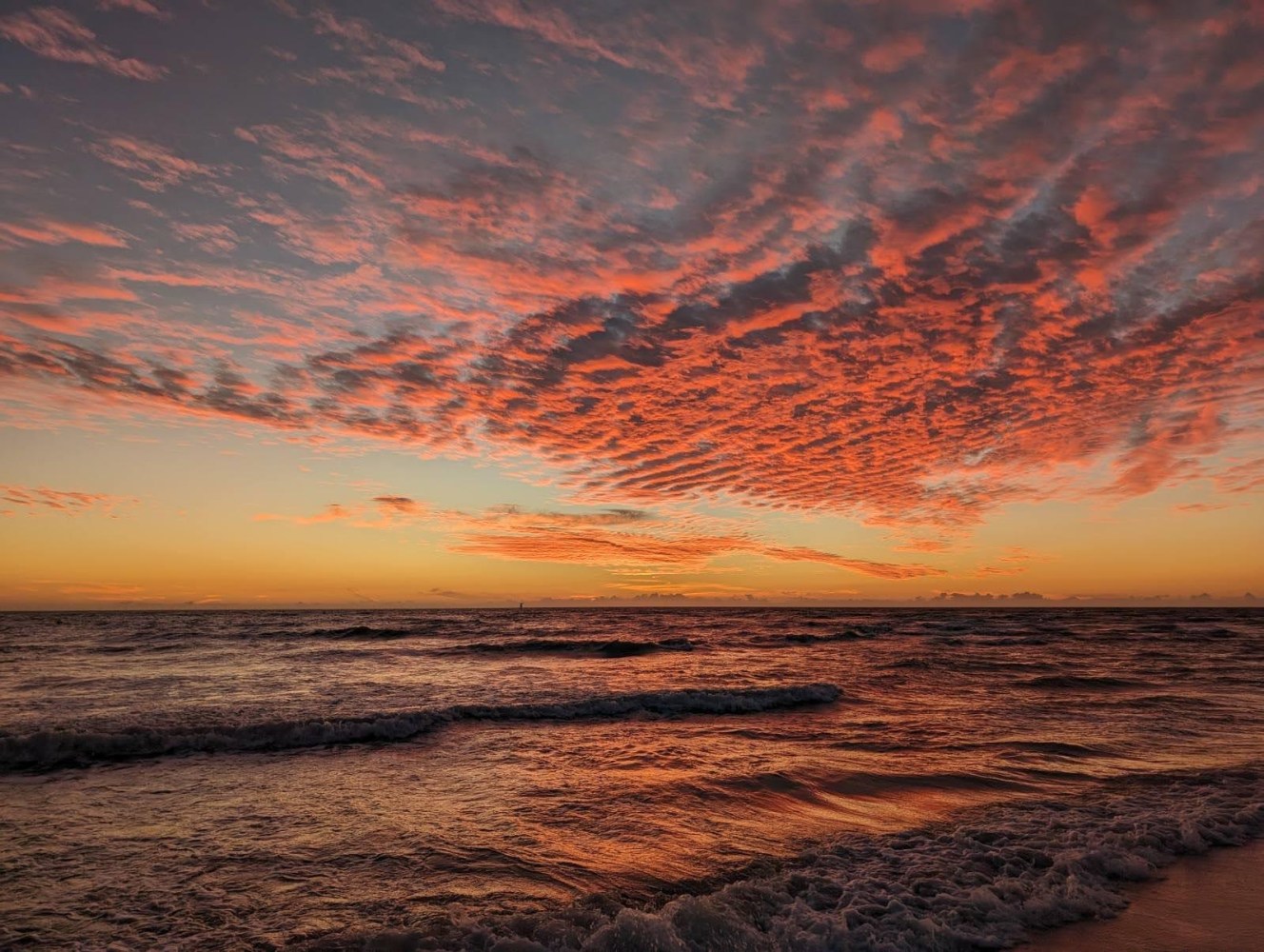 a sunset over a body of water