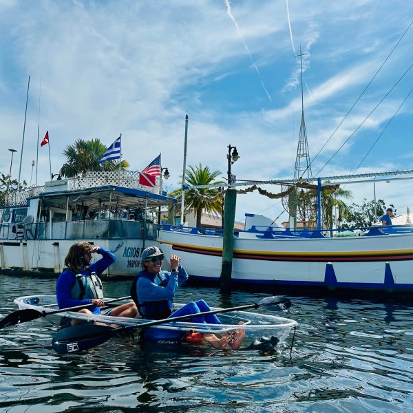 a group of people on a boat in the water