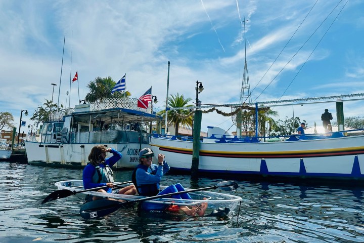 a group of people on a boat in the water