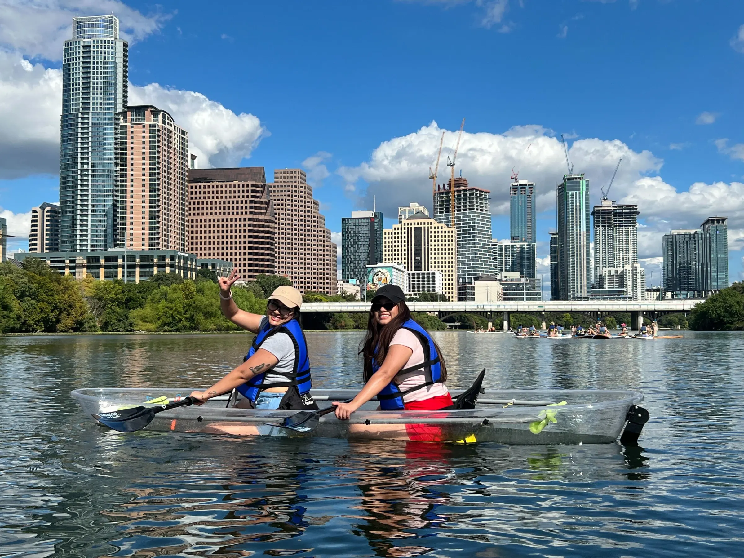 a group of people rowing a boat in the water