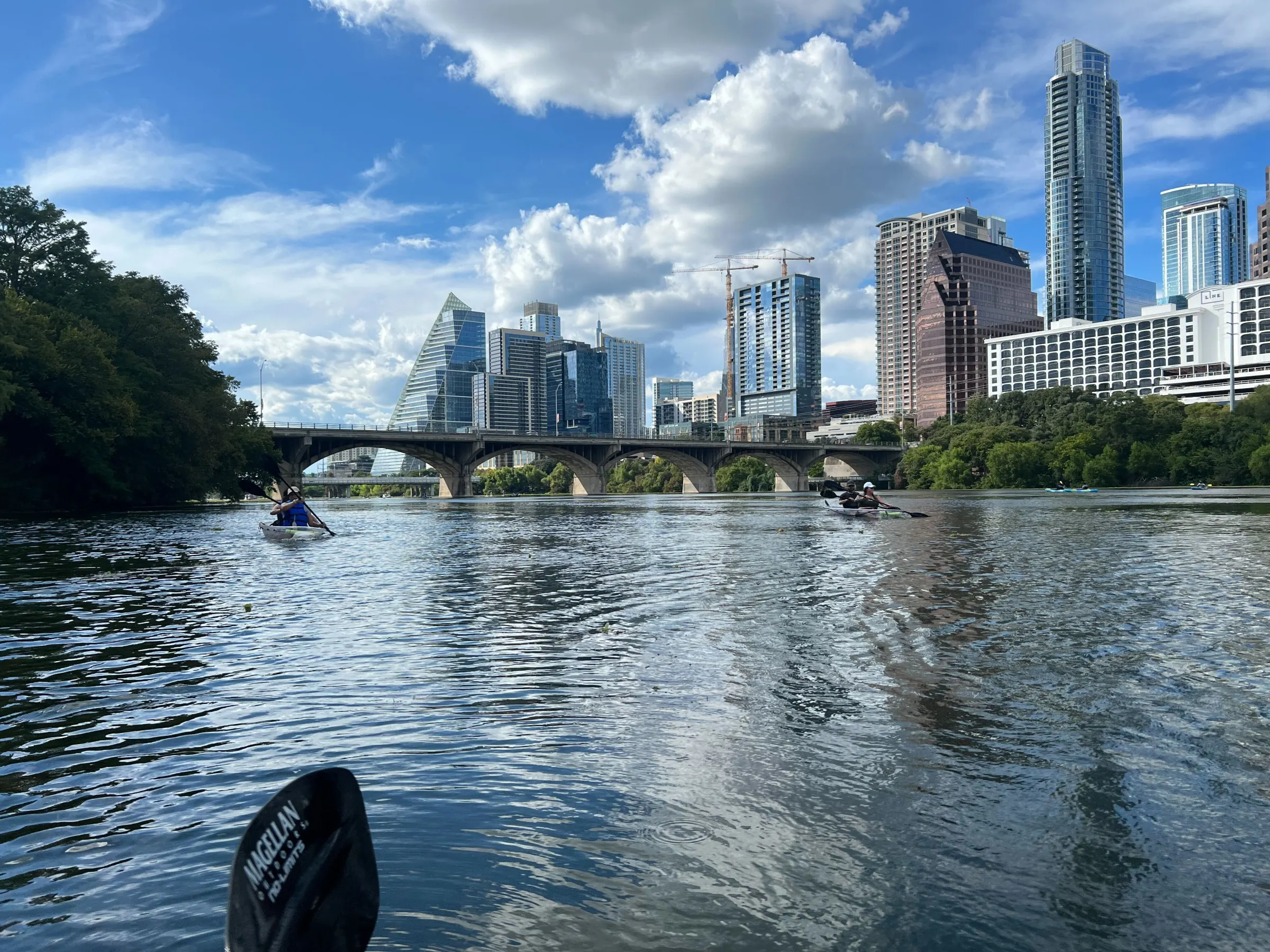 a large body of water with a city in the background