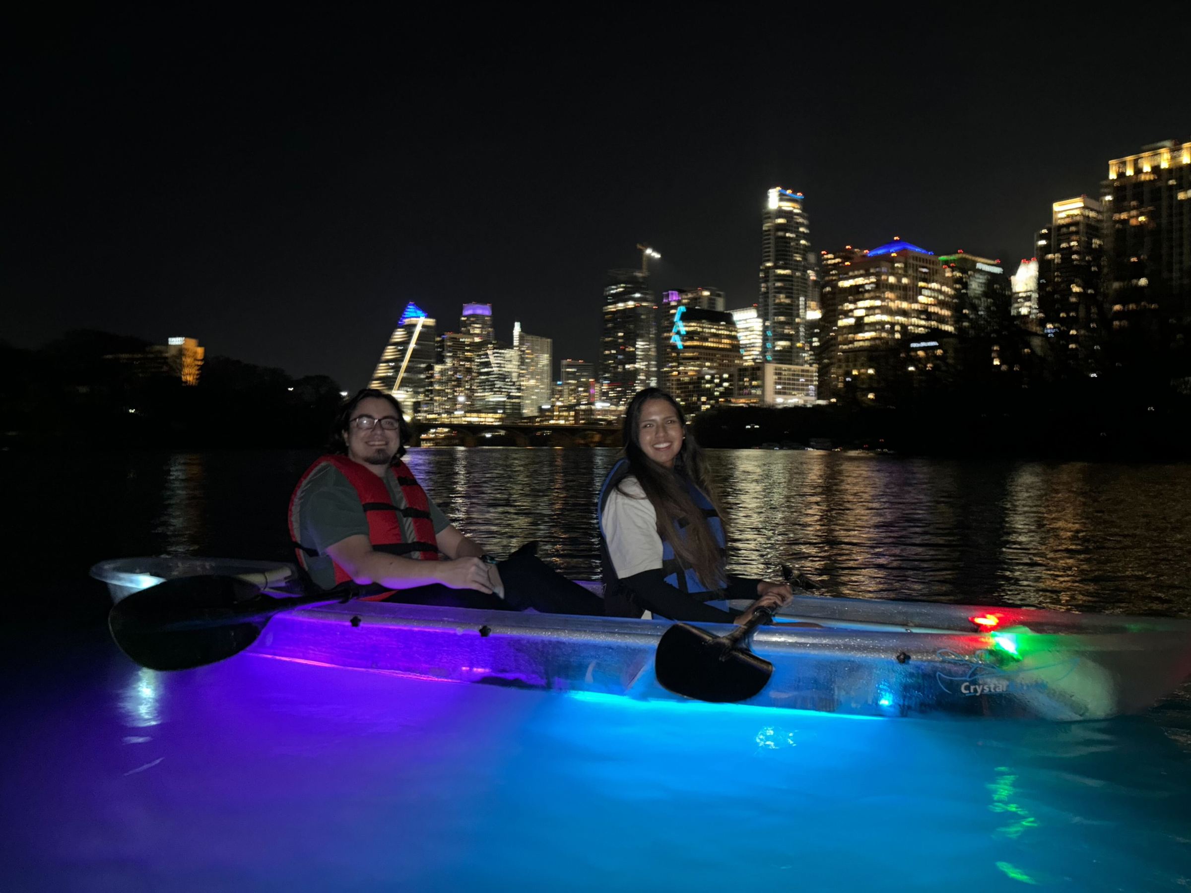 a person riding on the back of a boat in the water