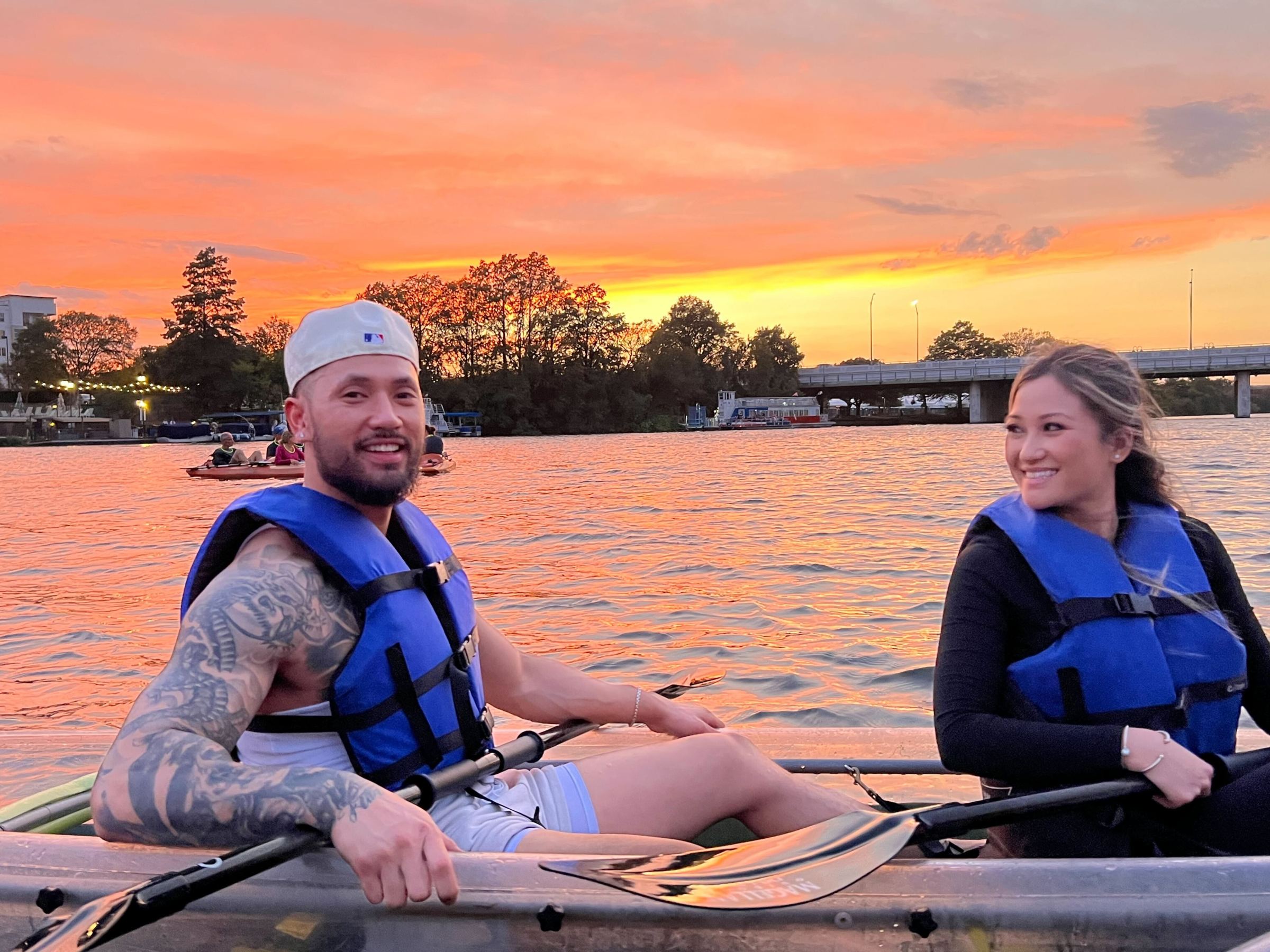 a person sitting in a boat on a body of water