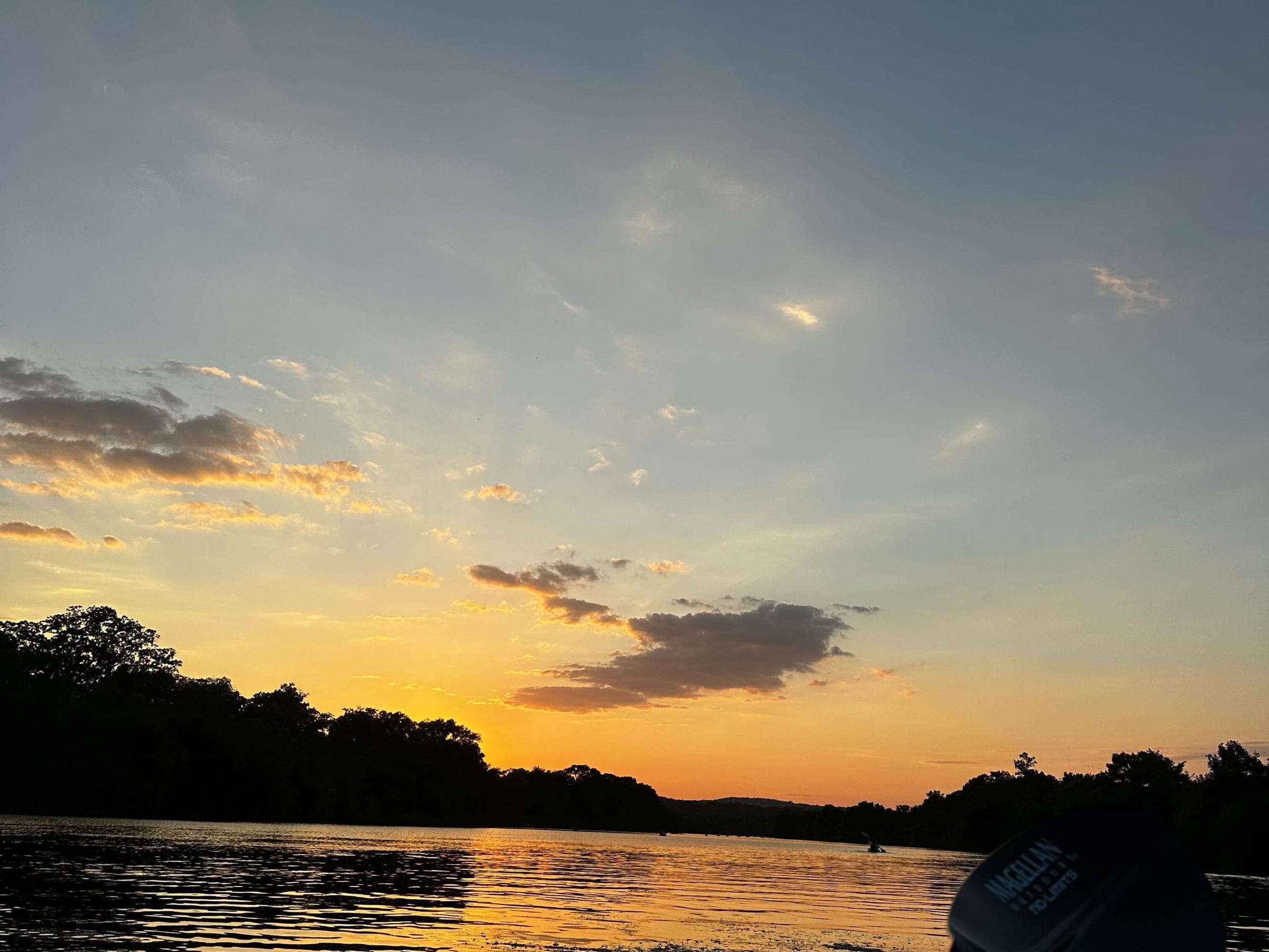 a sunset over a body of water