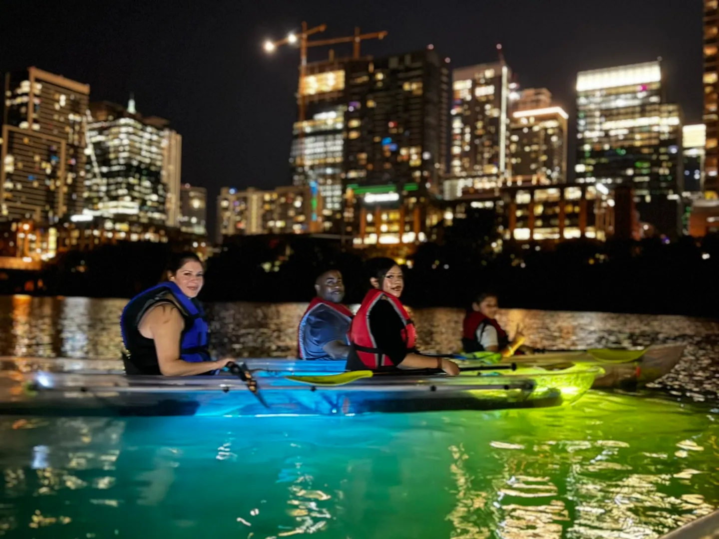 a group of people on a boat in the water