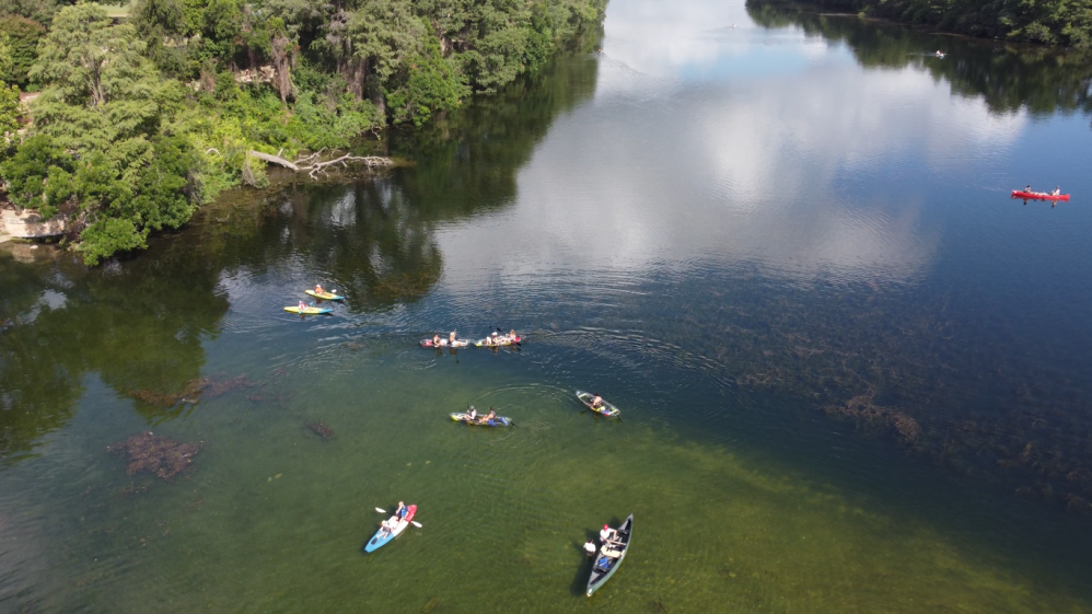 a group of people in a body of water