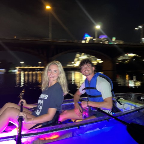 a man and a woman sitting on a stage