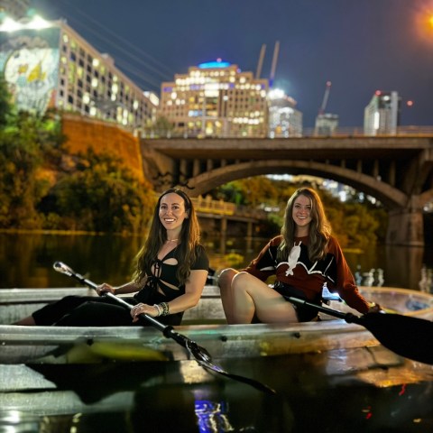 a person riding on the back of a boat