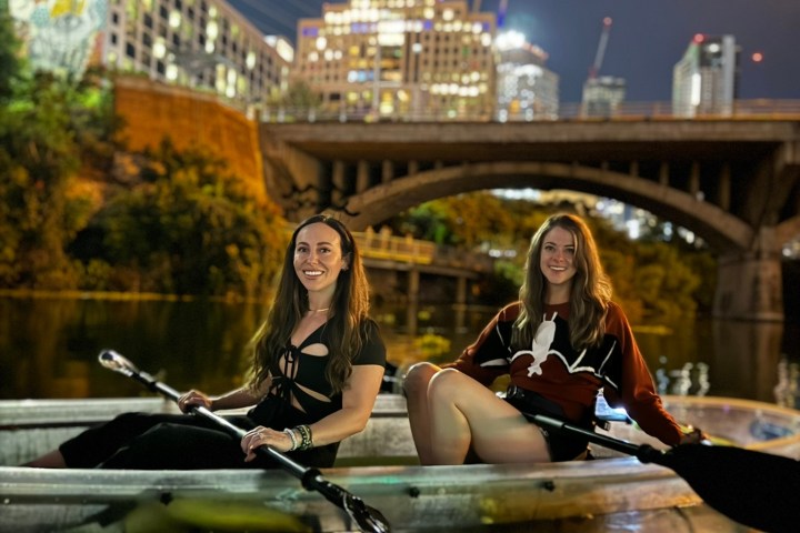 a person riding on the back of a boat