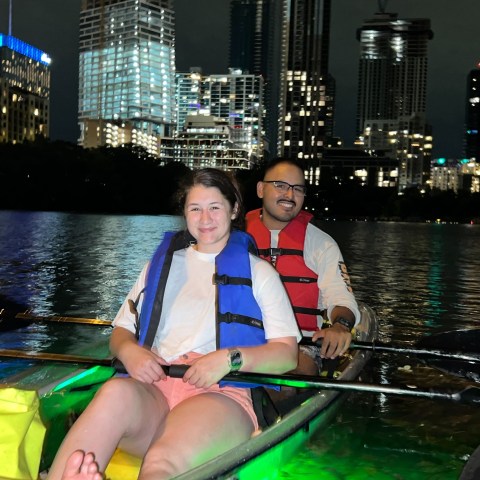 a person sitting on a boat in the water