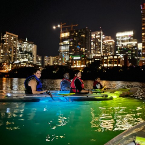 a group of people on a boat in the water