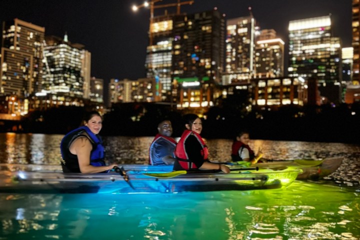 a group of people on a boat in the water