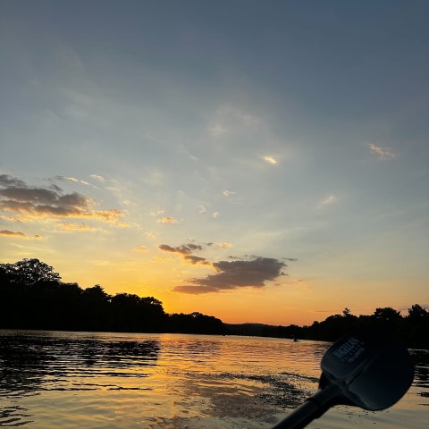 a sunset over a body of water