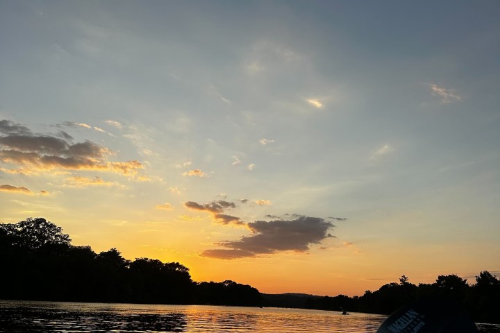 a sunset over a body of water