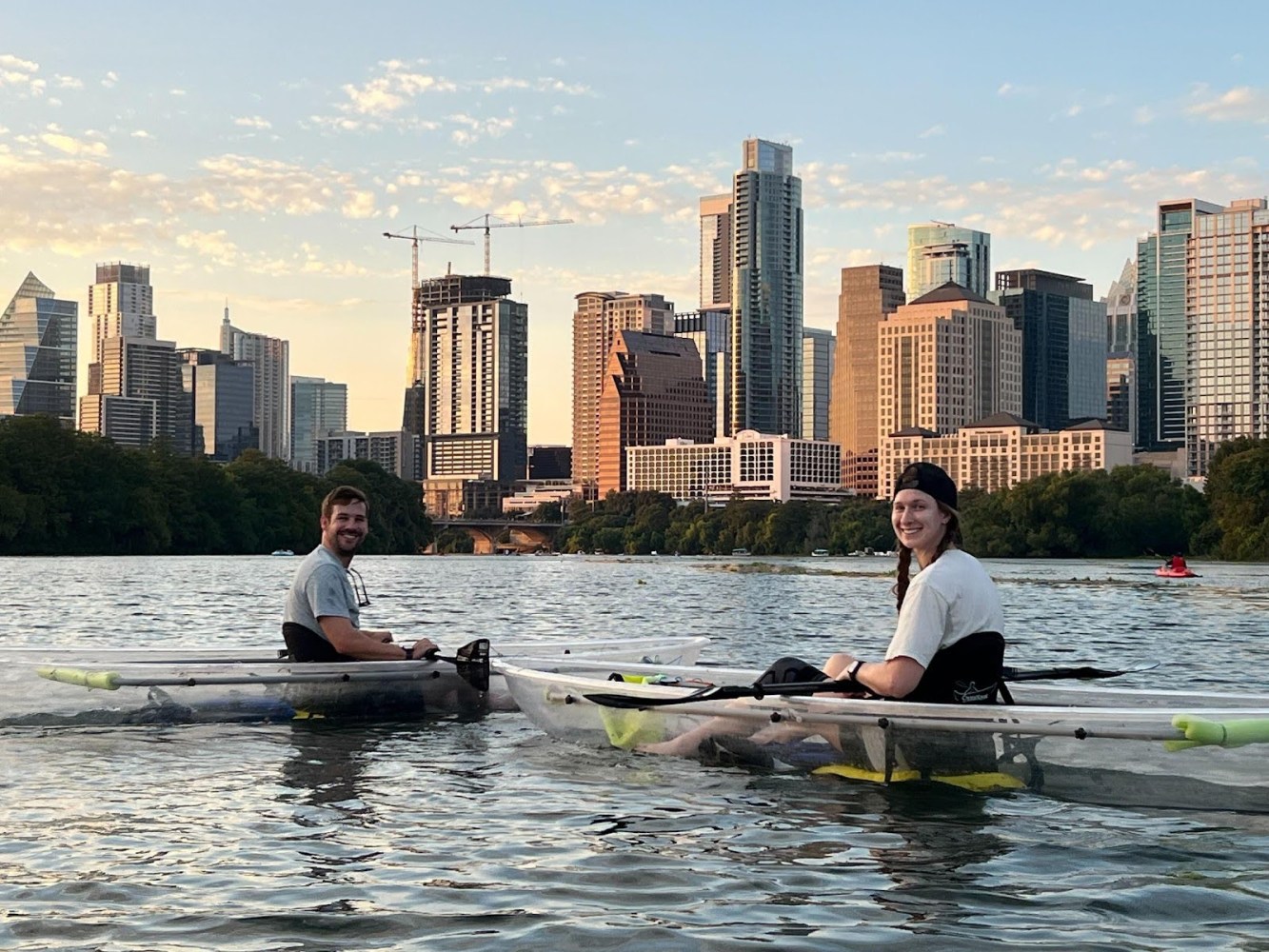 a group of people rowing a boat in the water