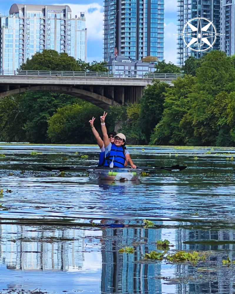 a person riding on the back of a boat in the water