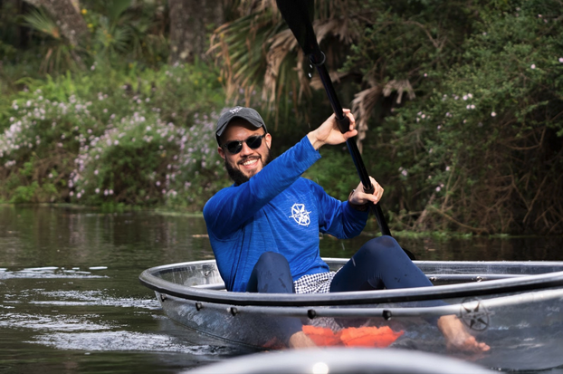 a man rowing a boat in the water