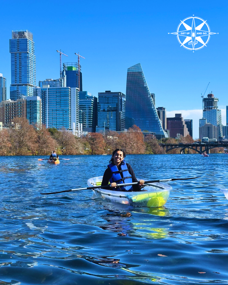 a man riding on the back of a boat in the water