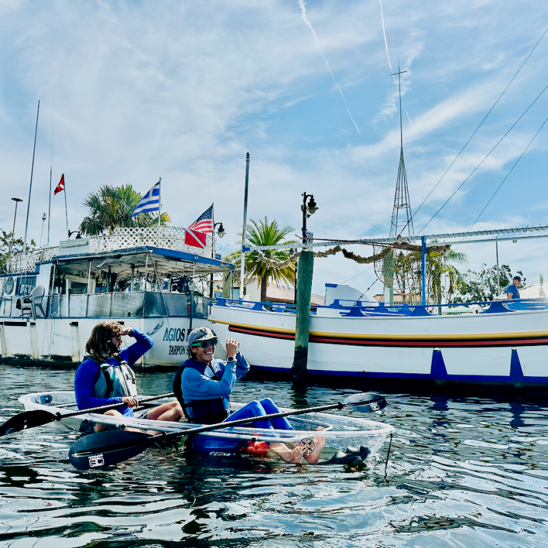a group of people on a boat in the water